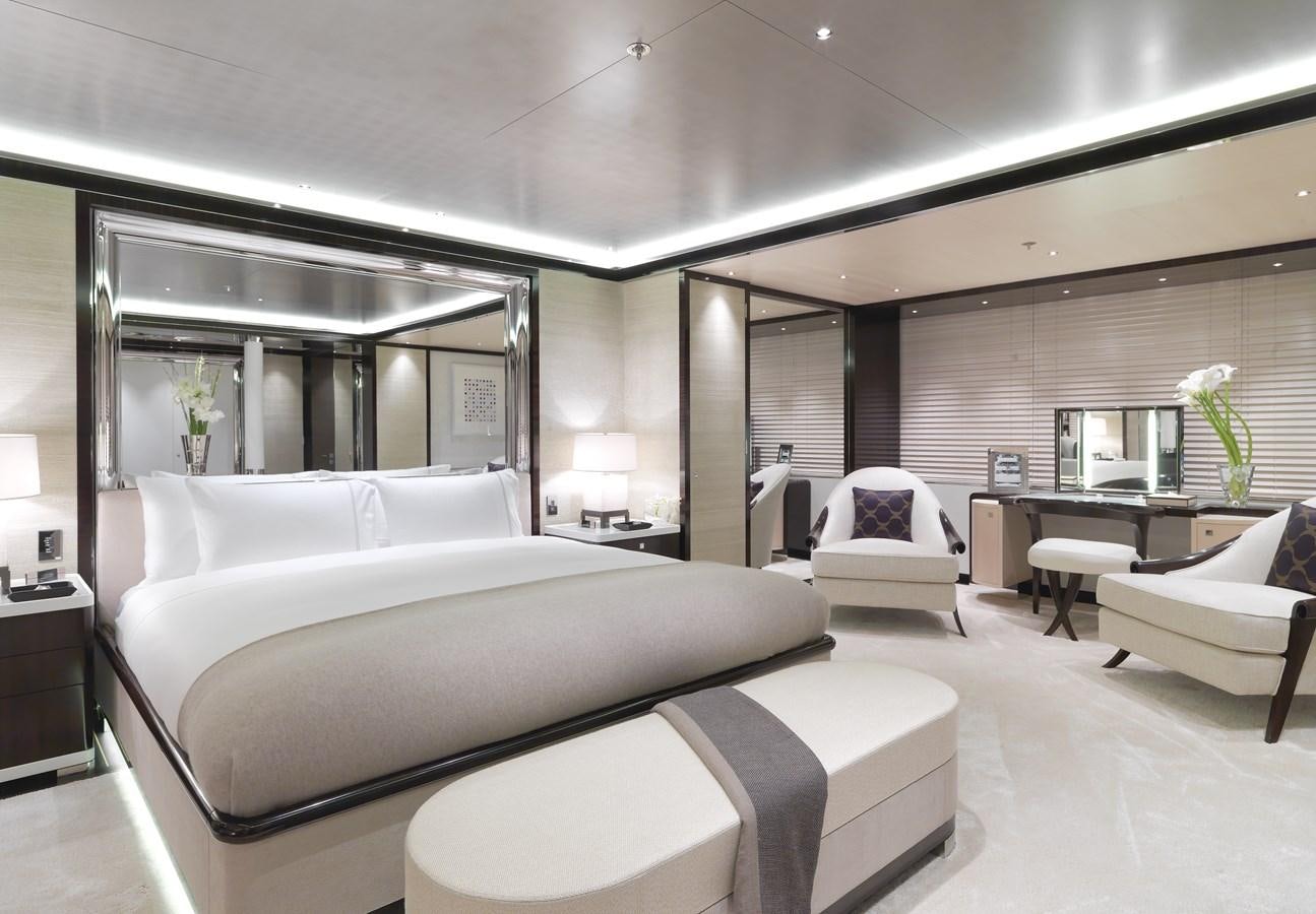 a room with a bed and a couch aboard KAHALANI Yacht for Sale