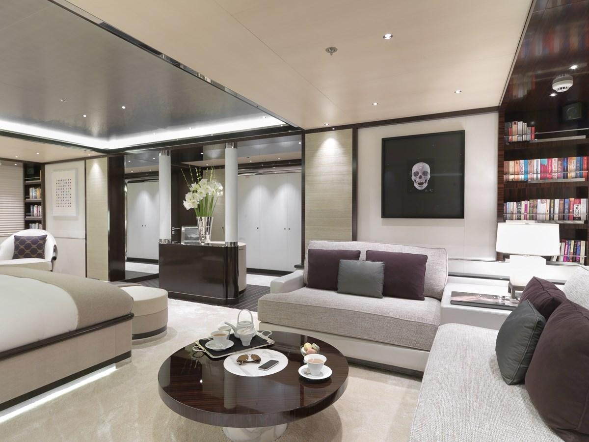 a living room with a couch and a coffee table aboard KAHALANI Yacht for Sale