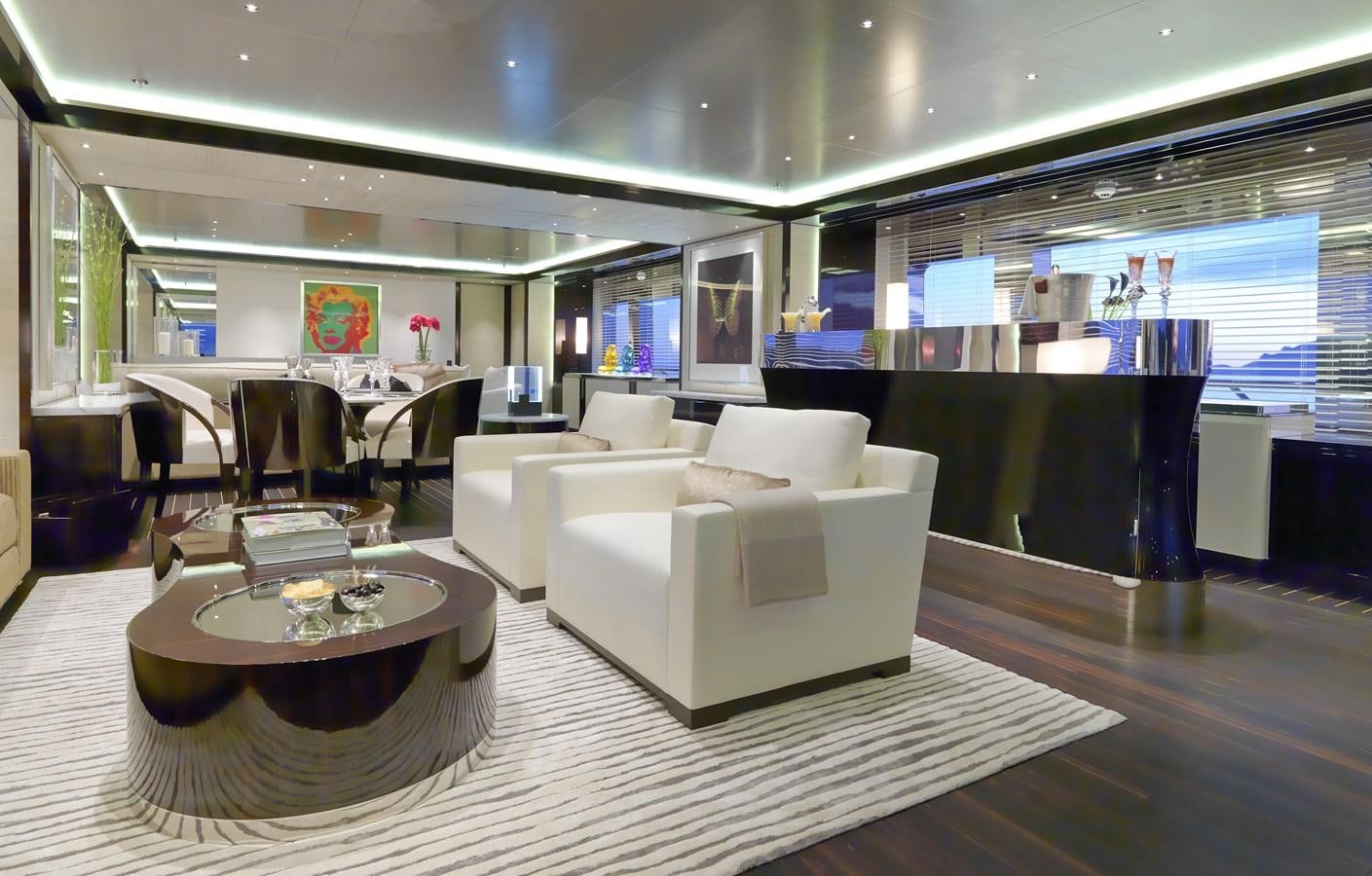 a room with a table and chairs aboard KAHALANI Yacht for Sale