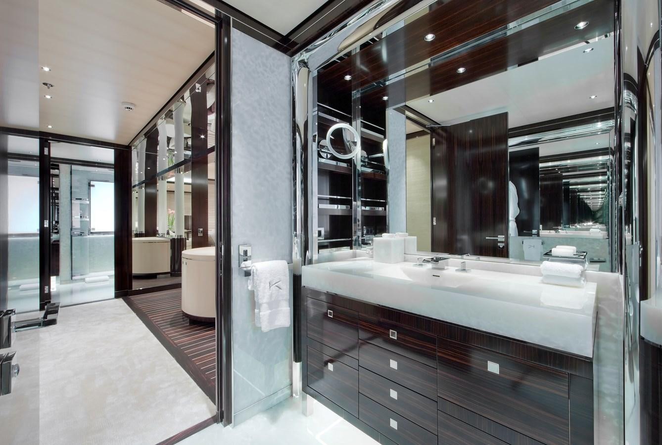 a bathroom with a large mirror aboard KAHALANI Yacht for Sale