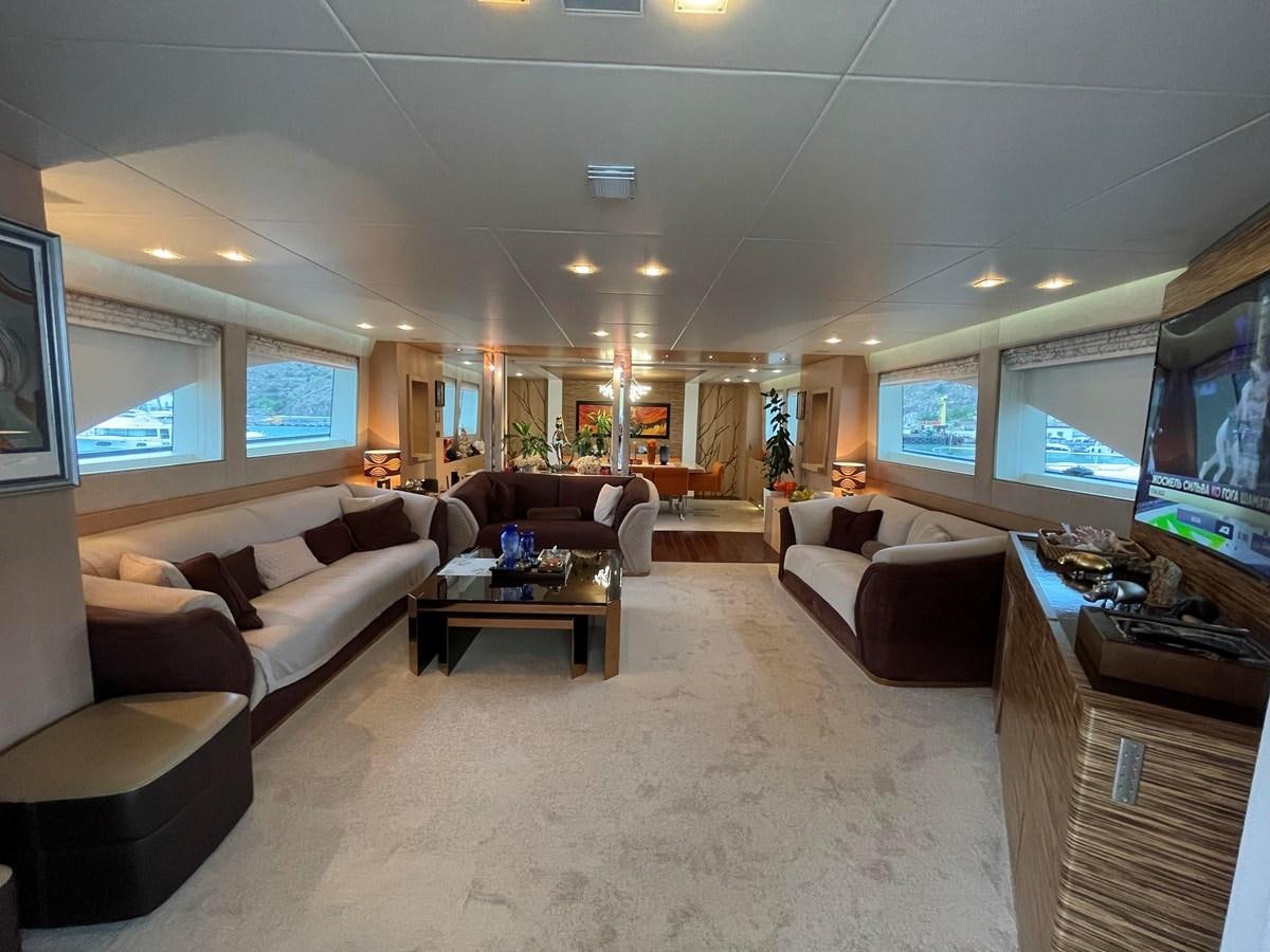 a living room with a large screen aboard ESPRESSO Yacht for Sale