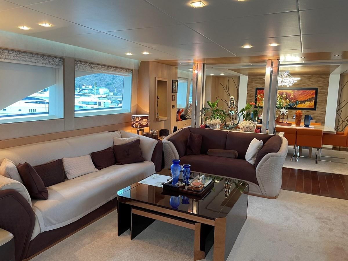 a living room with a couch and a coffee table aboard ESPRESSO Yacht for Sale
