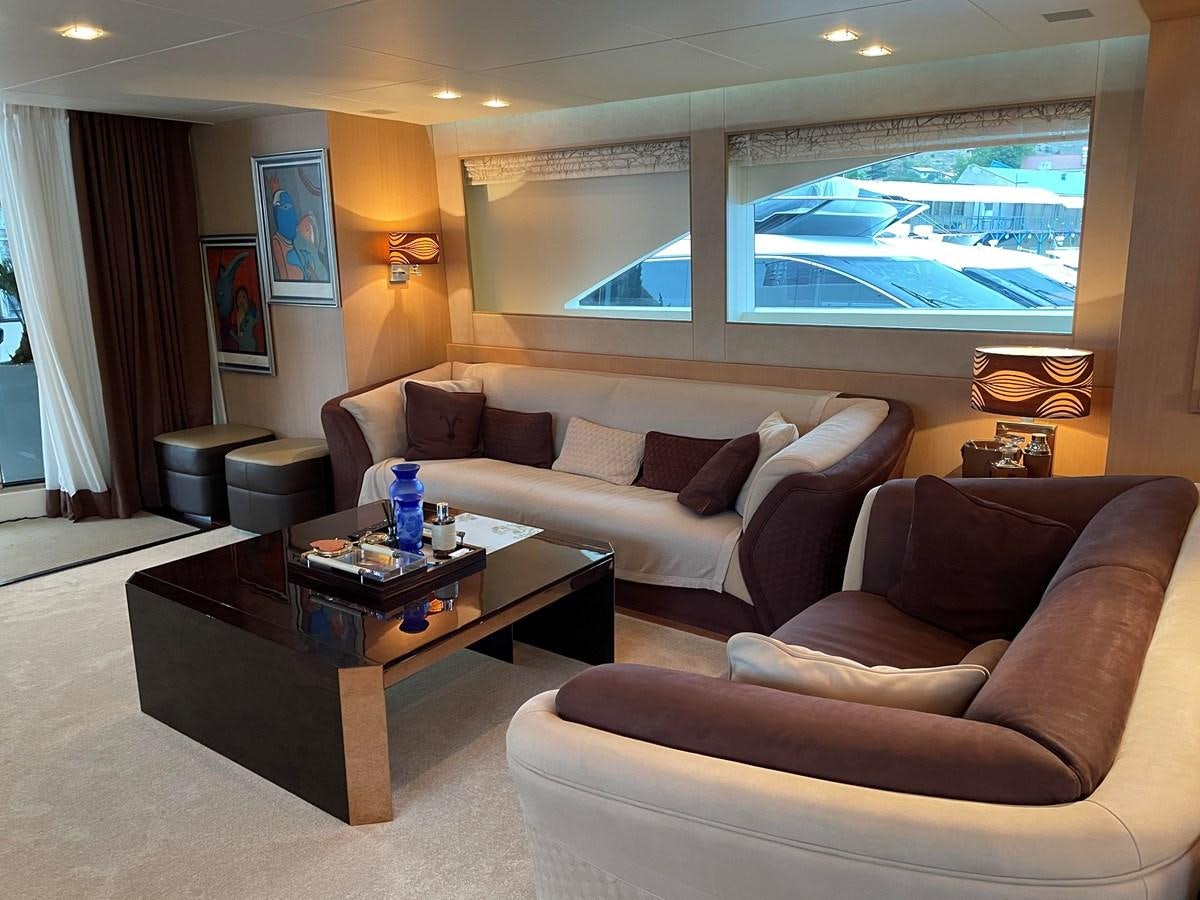 a living room with a couch and coffee table aboard ESPRESSO Yacht for Sale
