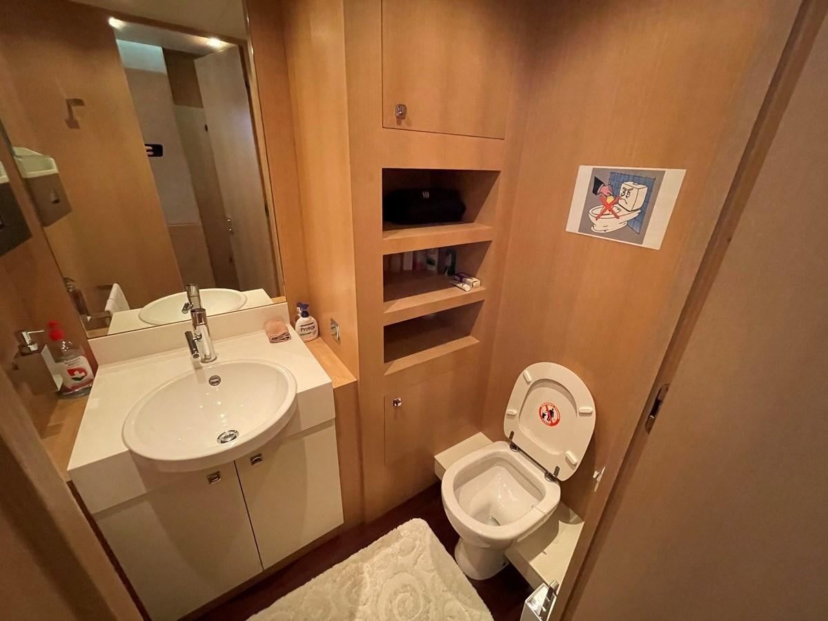 a bathroom with a toilet and a sink aboard ESPRESSO Yacht for Sale