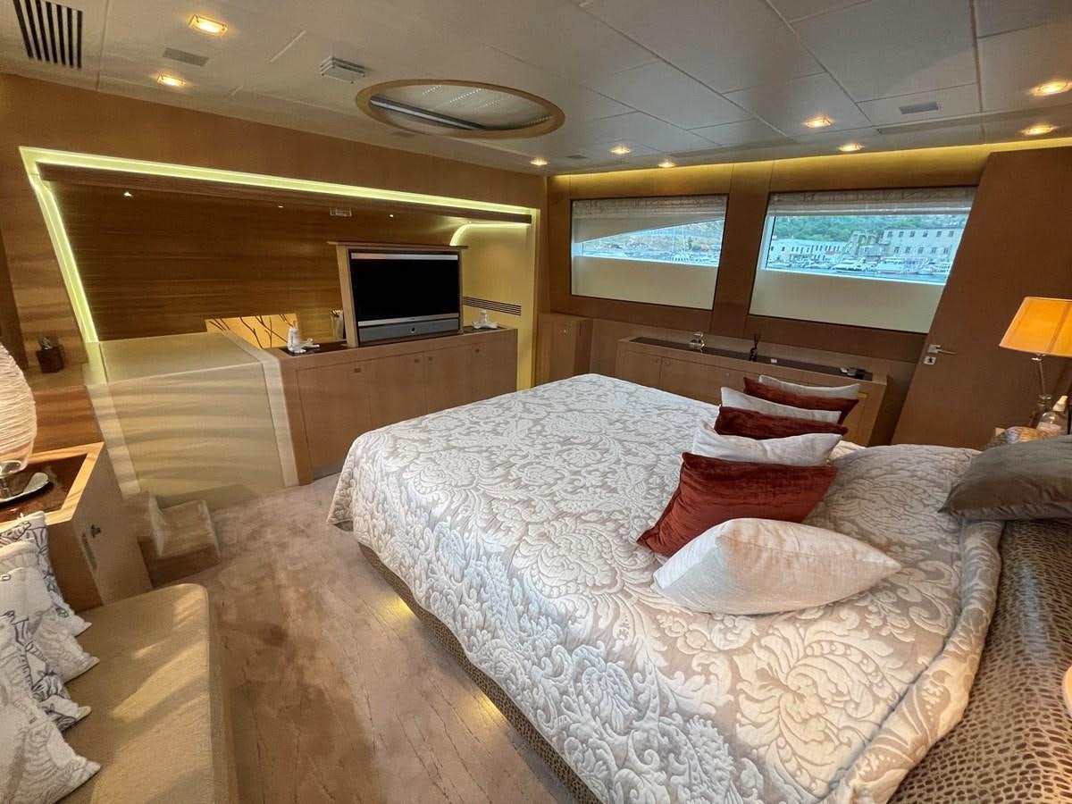 a room with a bed and a tv aboard ESPRESSO Yacht for Sale