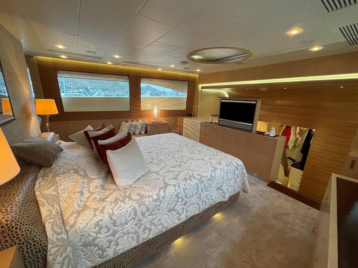 a hotel room with a bed and a tv aboard ESPRESSO Yacht for Sale