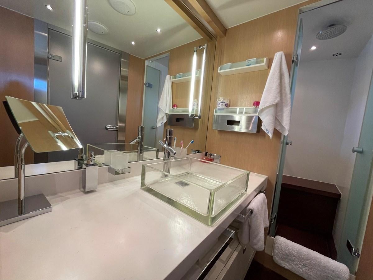 a bathroom with a large mirror aboard ESPRESSO Yacht for Sale