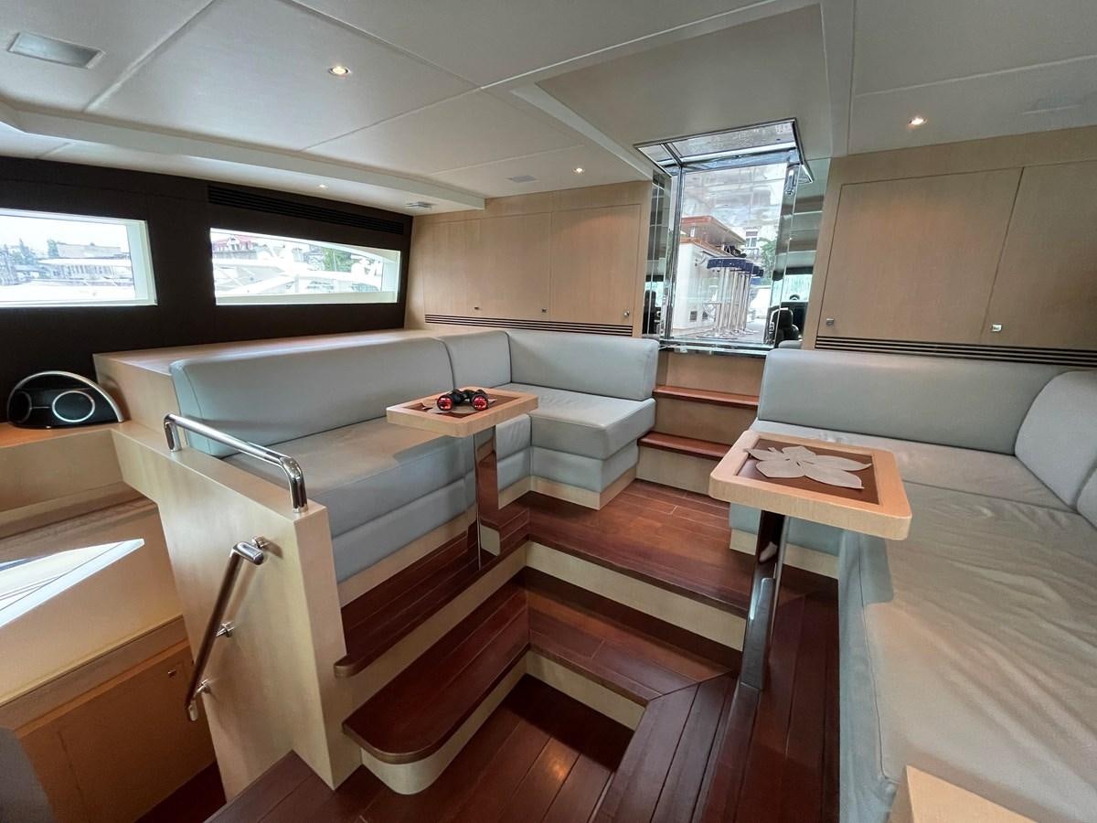 a room with a couch and a table and a television aboard ESPRESSO Yacht for Sale