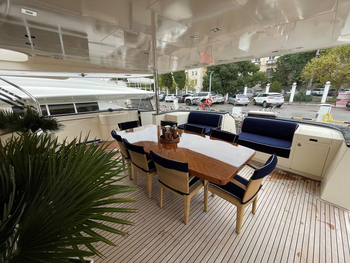 a table and chairs on a deck aboard ESPRESSO Yacht for Sale