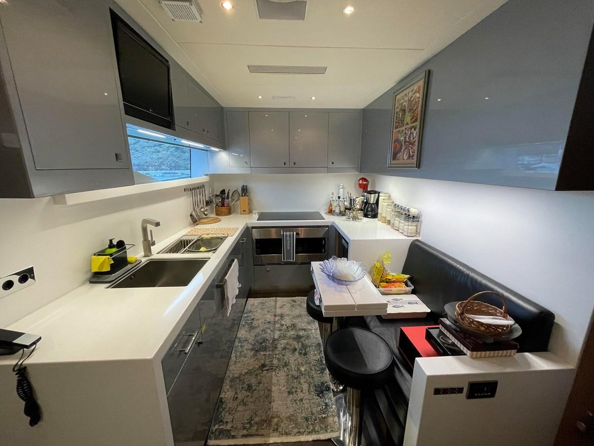 a kitchen with a sink and a stove aboard ESPRESSO Yacht for Sale