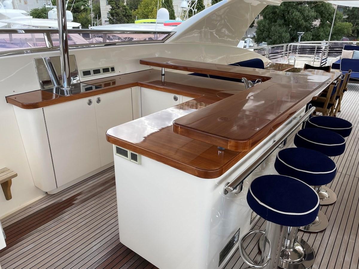 a wooden boat on a deck aboard ESPRESSO Yacht for Sale