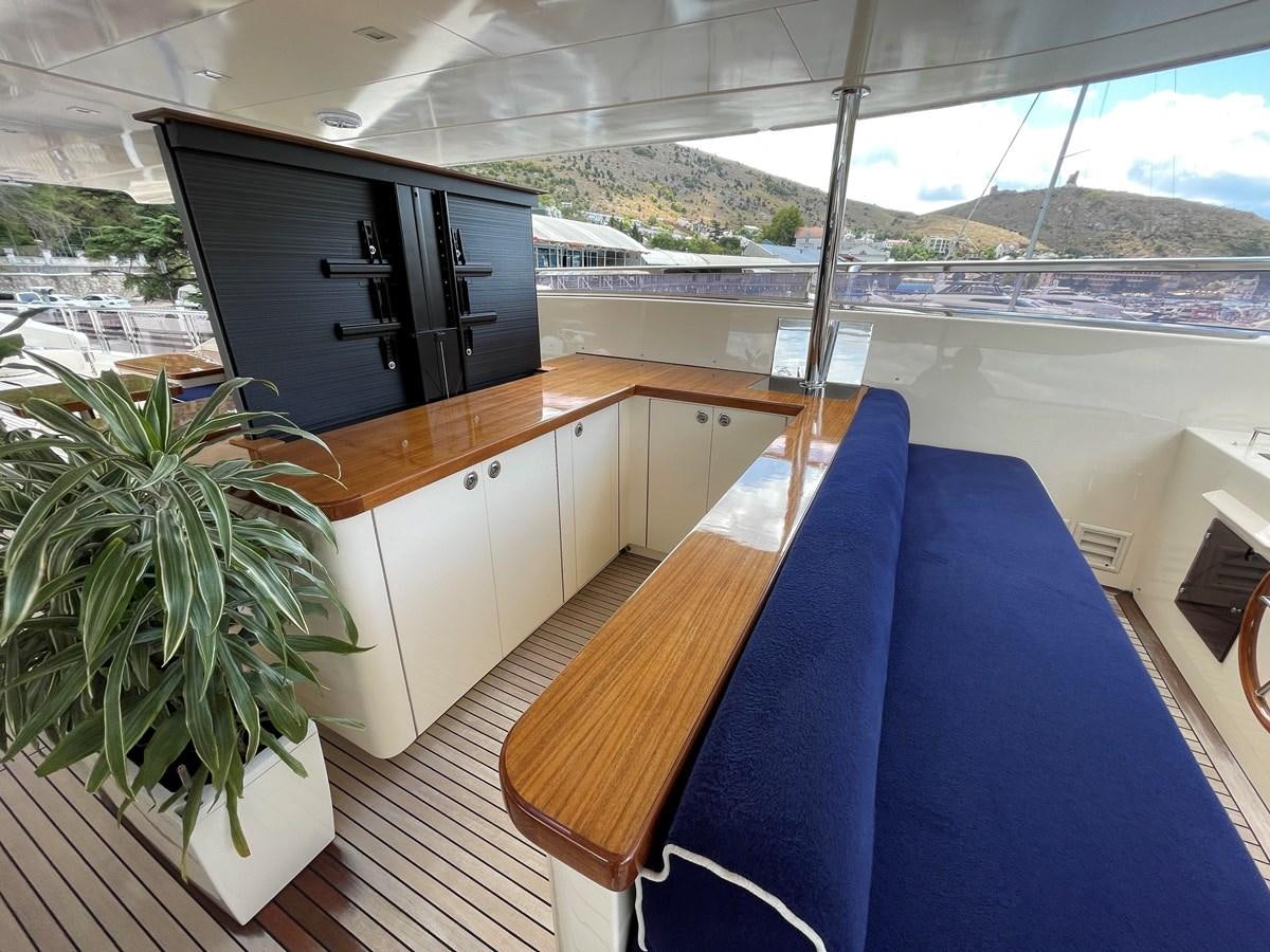 a room with a table and a bed aboard ESPRESSO Yacht for Sale