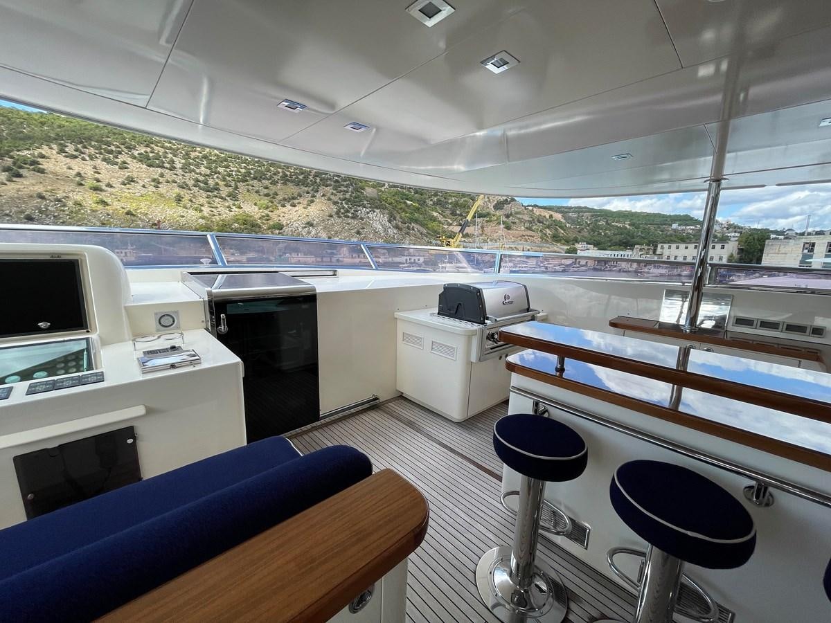 a boat with a desk and chairs aboard ESPRESSO Yacht for Sale