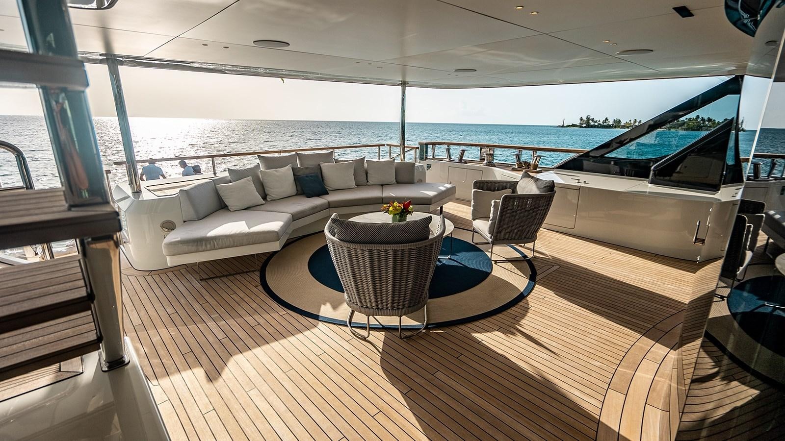 a living room with a couch and a table aboard KOJU Yacht for Sale