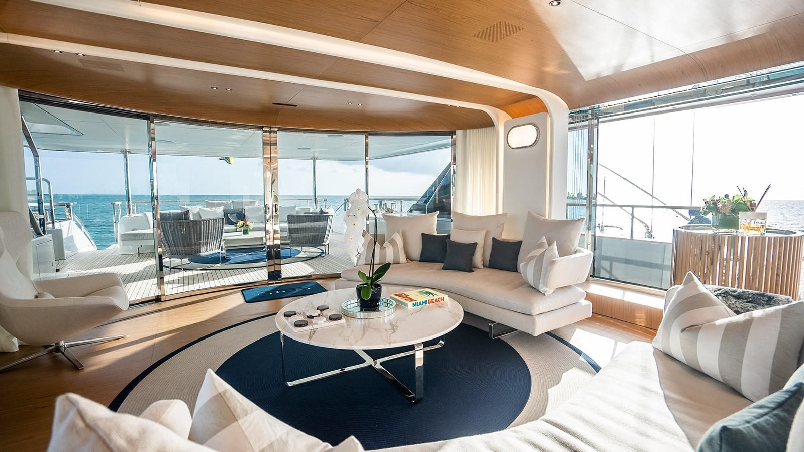 a living room with a large window aboard KOJU Yacht for Sale