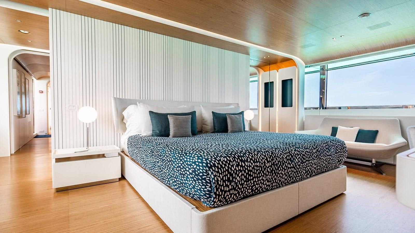 a large bed in a room aboard KOJU Yacht for Sale