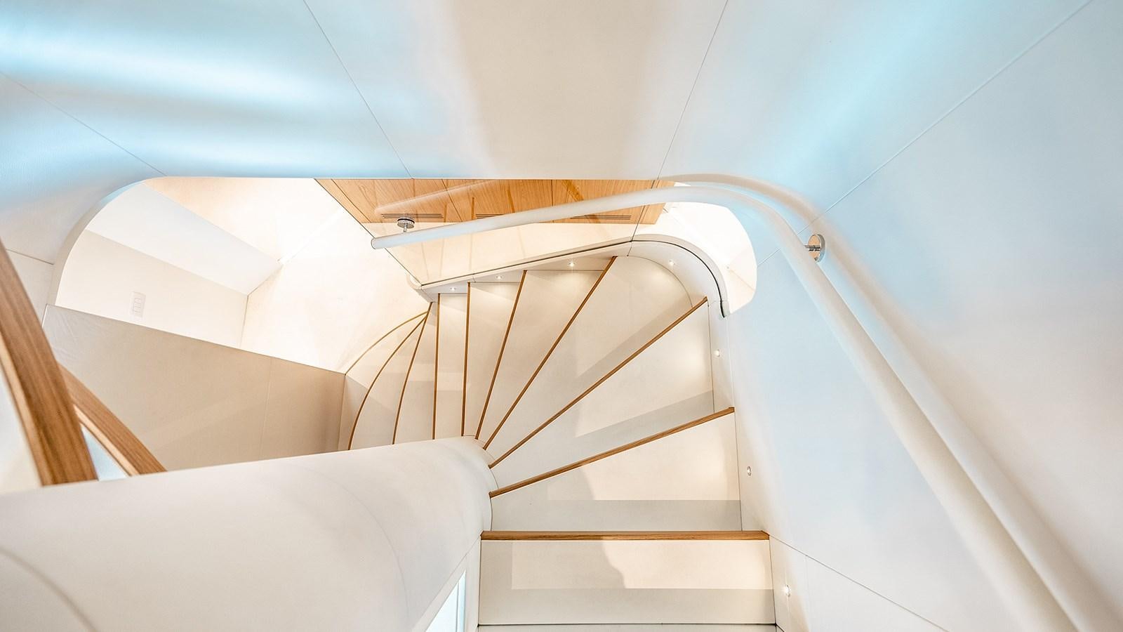 a staircase with a railing aboard KOJU Yacht for Sale