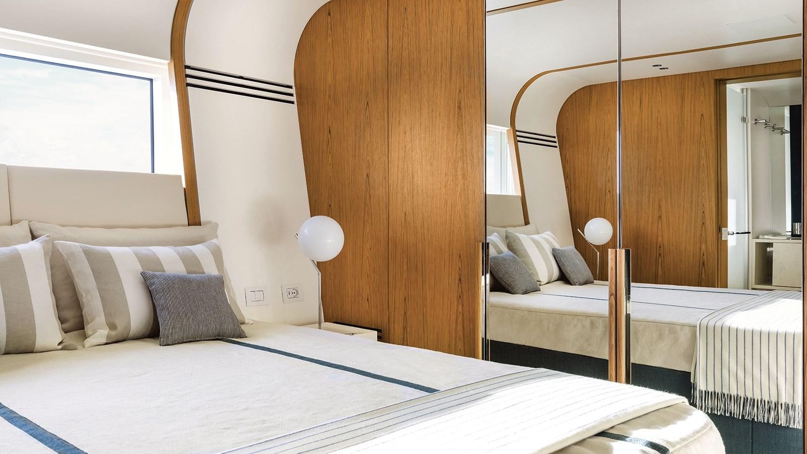 a room with two beds aboard KOJU Yacht for Sale