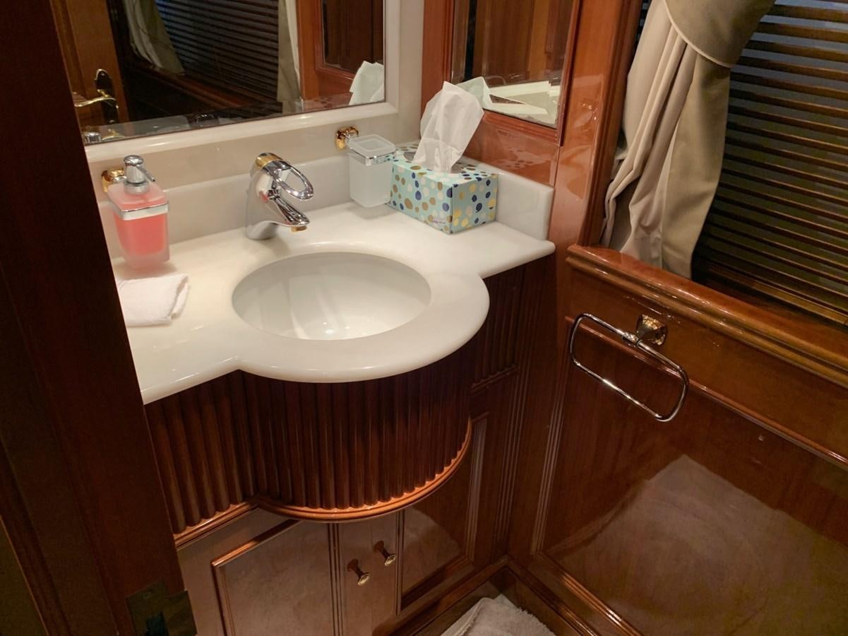 a bathroom sink with a mirror aboard DREAM ON II Yacht for Sale