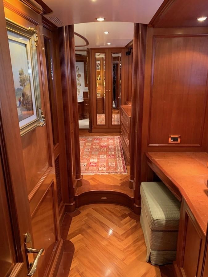 a hallway with a desk and a chair aboard DREAM ON II Yacht for Sale