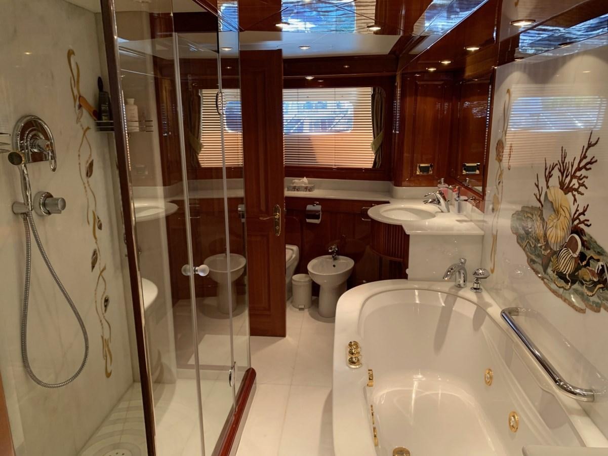a bathroom with a tub sink and toilet aboard DREAM ON II Yacht for Sale