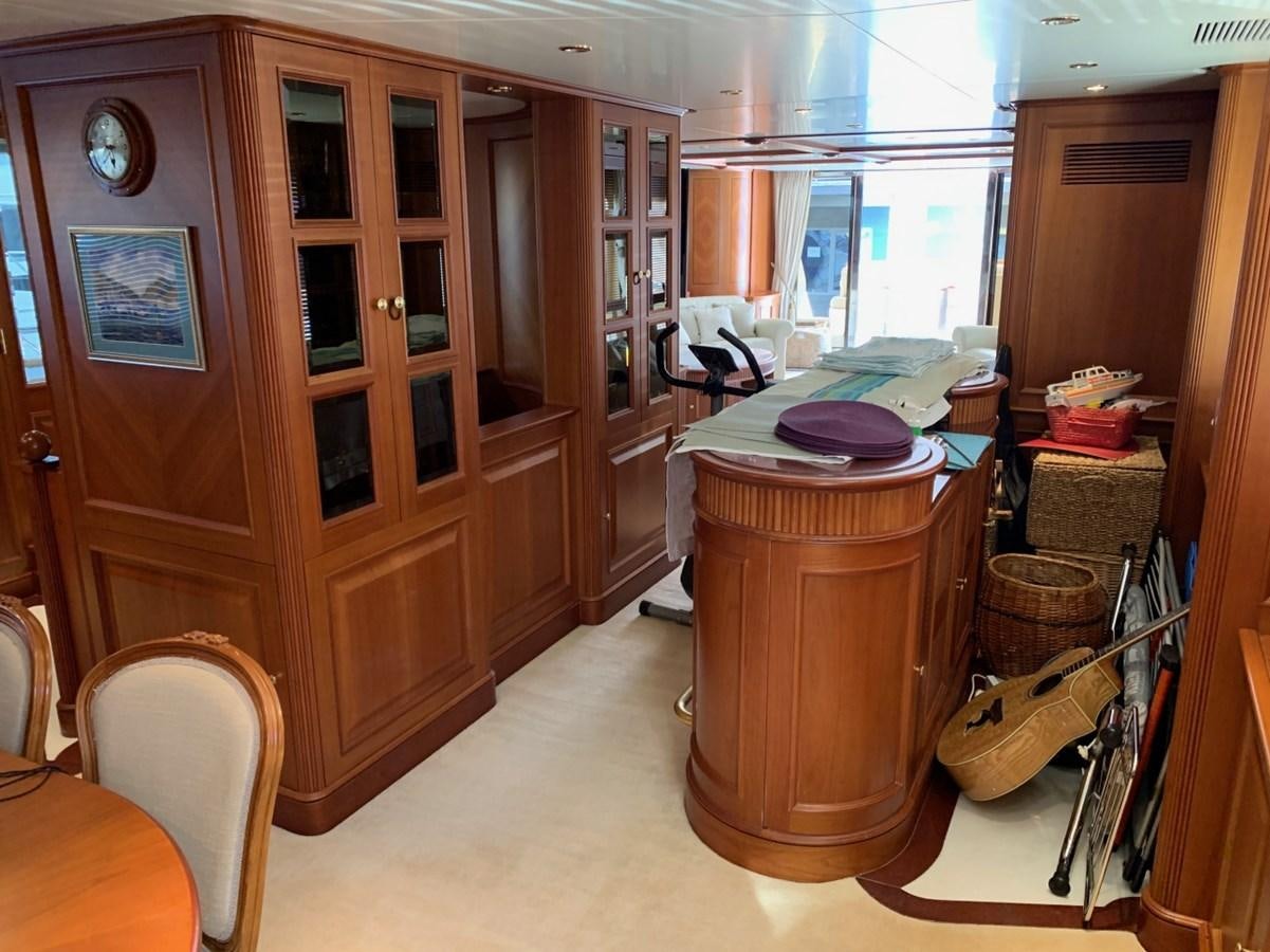 a kitchen with a large wooden cabinet aboard DREAM ON II Yacht for Sale