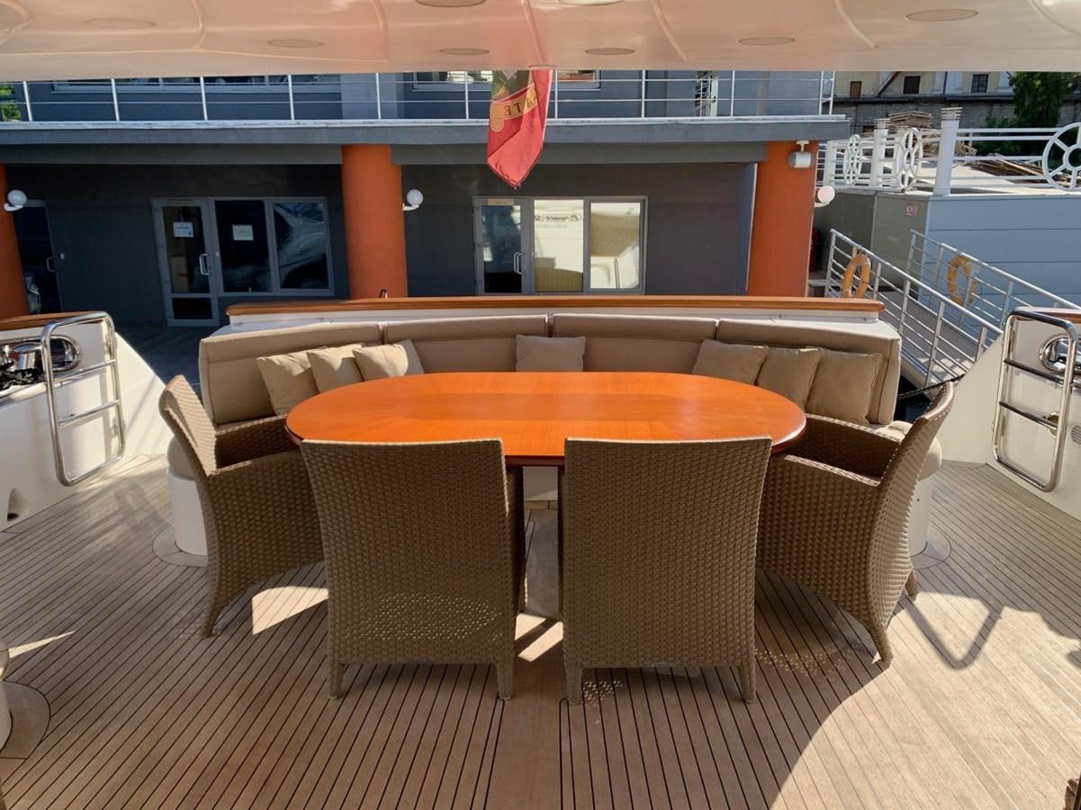 a table and chairs in a room aboard DREAM ON II Yacht for Sale