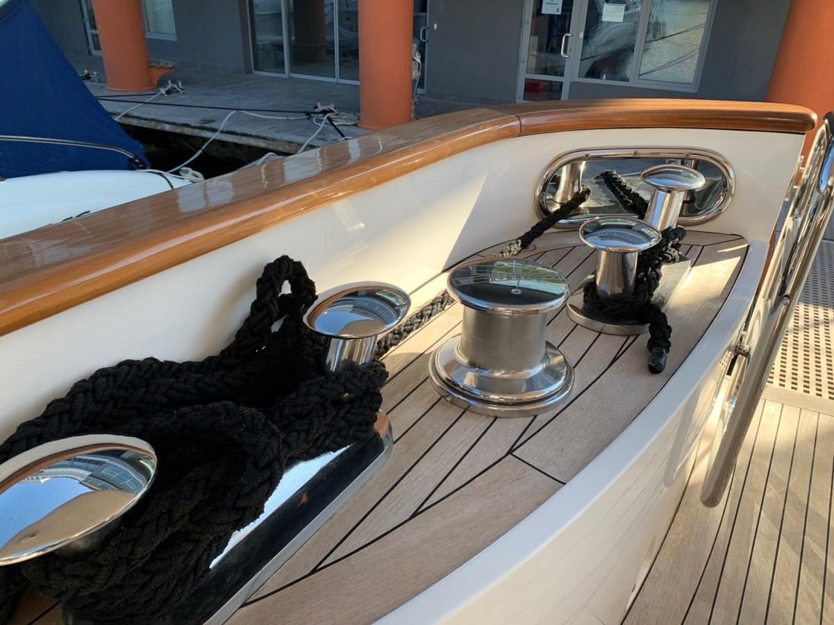 a black cat looking at a sink aboard DREAM ON II Yacht for Sale
