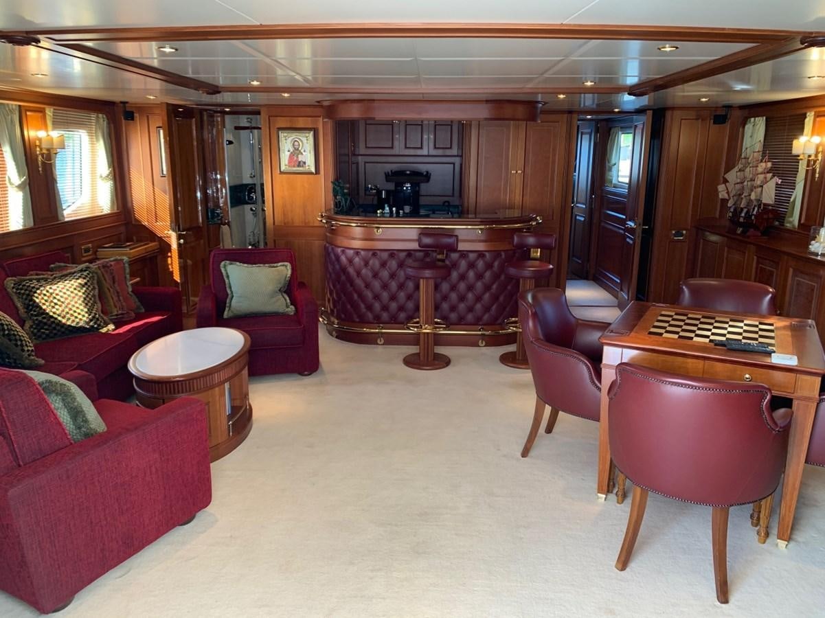 a living room with a piano aboard DREAM ON II Yacht for Sale