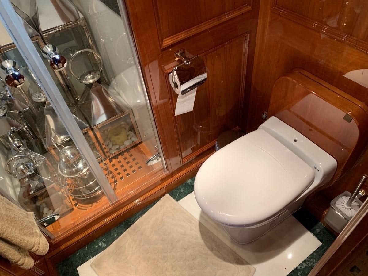 a bathroom with a glass shower aboard DREAM ON II Yacht for Sale