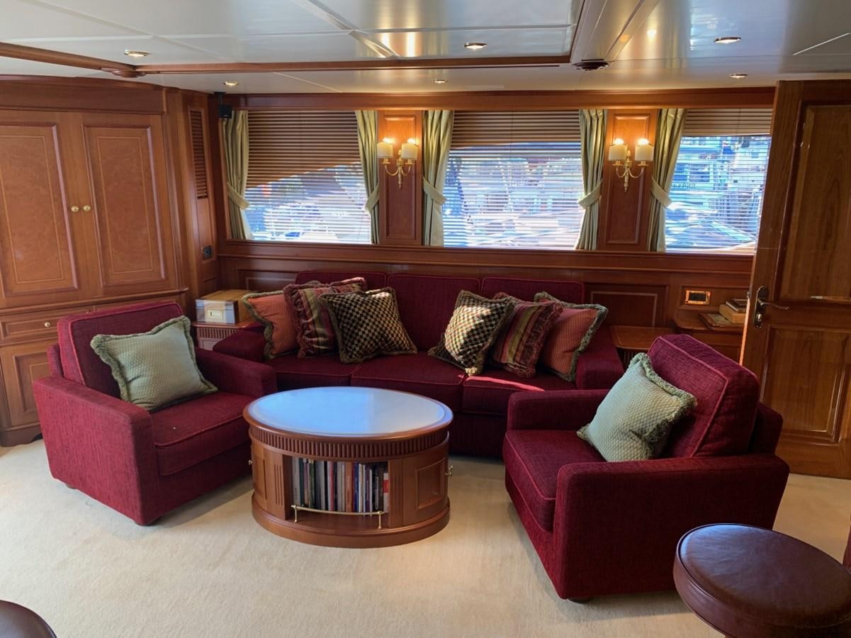 a living room with a couch and a table aboard DREAM ON II Yacht for Sale