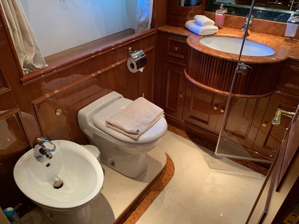 a bathroom with a sink toilet and a bathtub aboard DREAM ON II Yacht for Sale