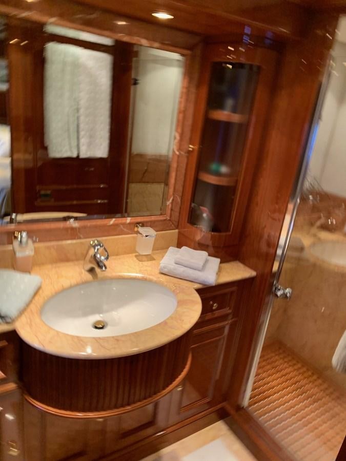 a bathroom with a sink and mirror aboard DREAM ON II Yacht for Sale