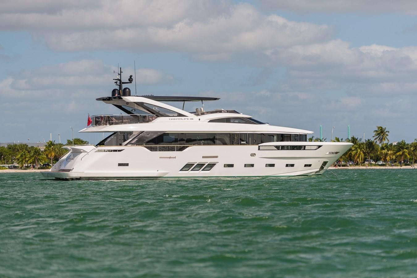 a white yacht in the water aboard THE PEDDLER Yacht for Sale