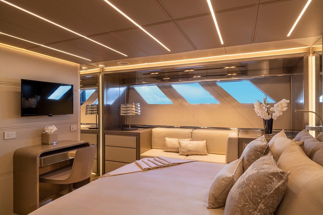 a room with a bed and a television aboard THE PEDDLER Yacht for Sale