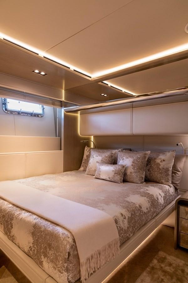 a bed with a white comforter aboard THE PEDDLER Yacht for Sale