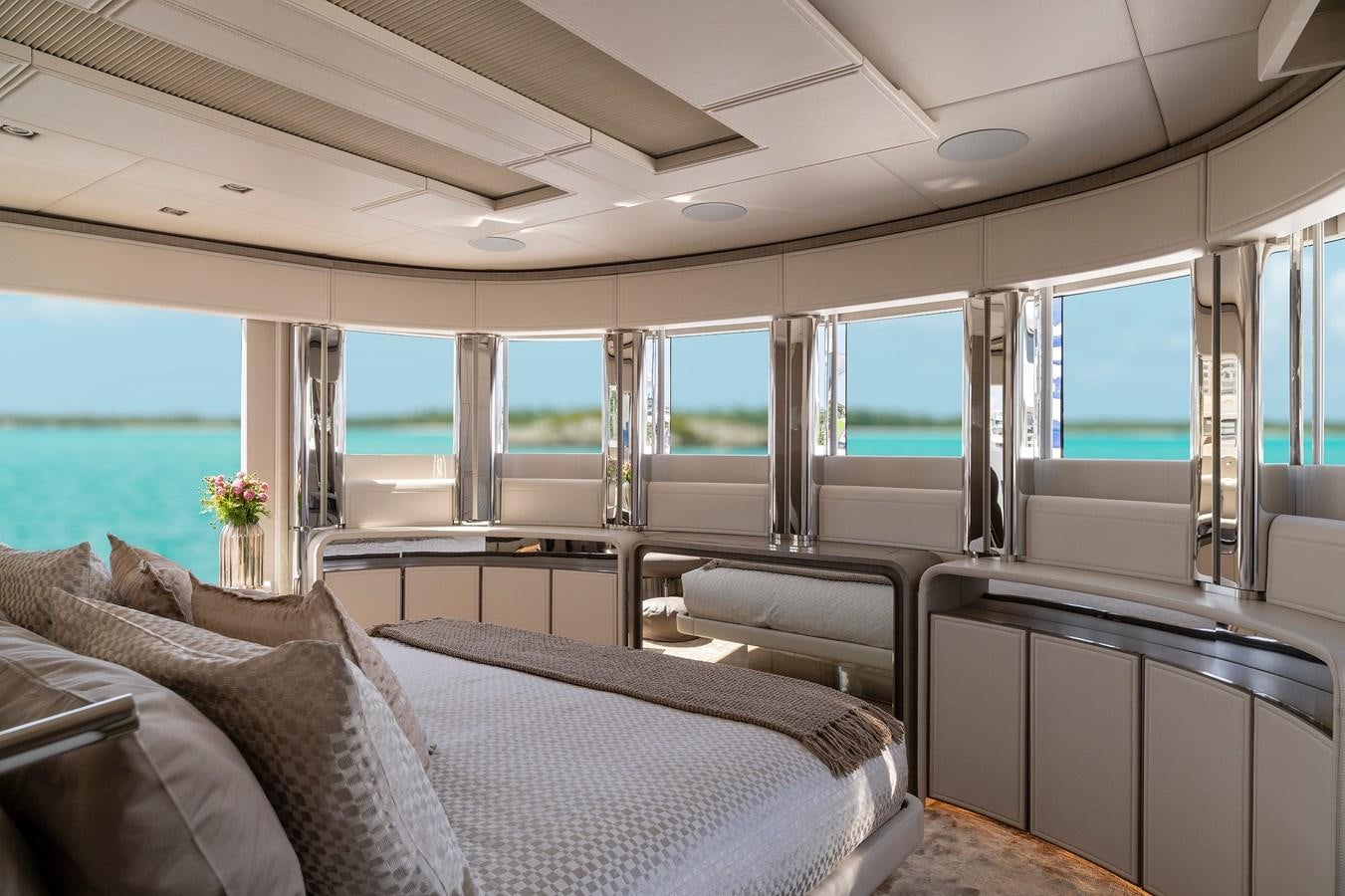 a room with a couch and a table with a window aboard THE PEDDLER Yacht for Sale