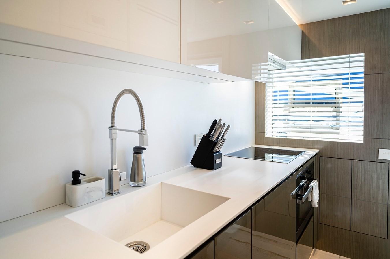 a bathroom with a sink and a faucet aboard THE PEDDLER Yacht for Sale