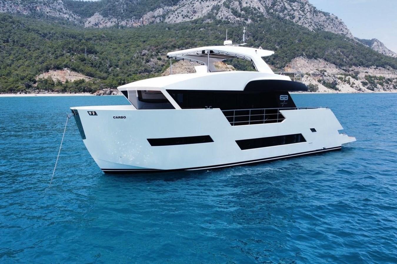 a white yacht in the water aboard CARBOYACHT 68 Yacht for Sale