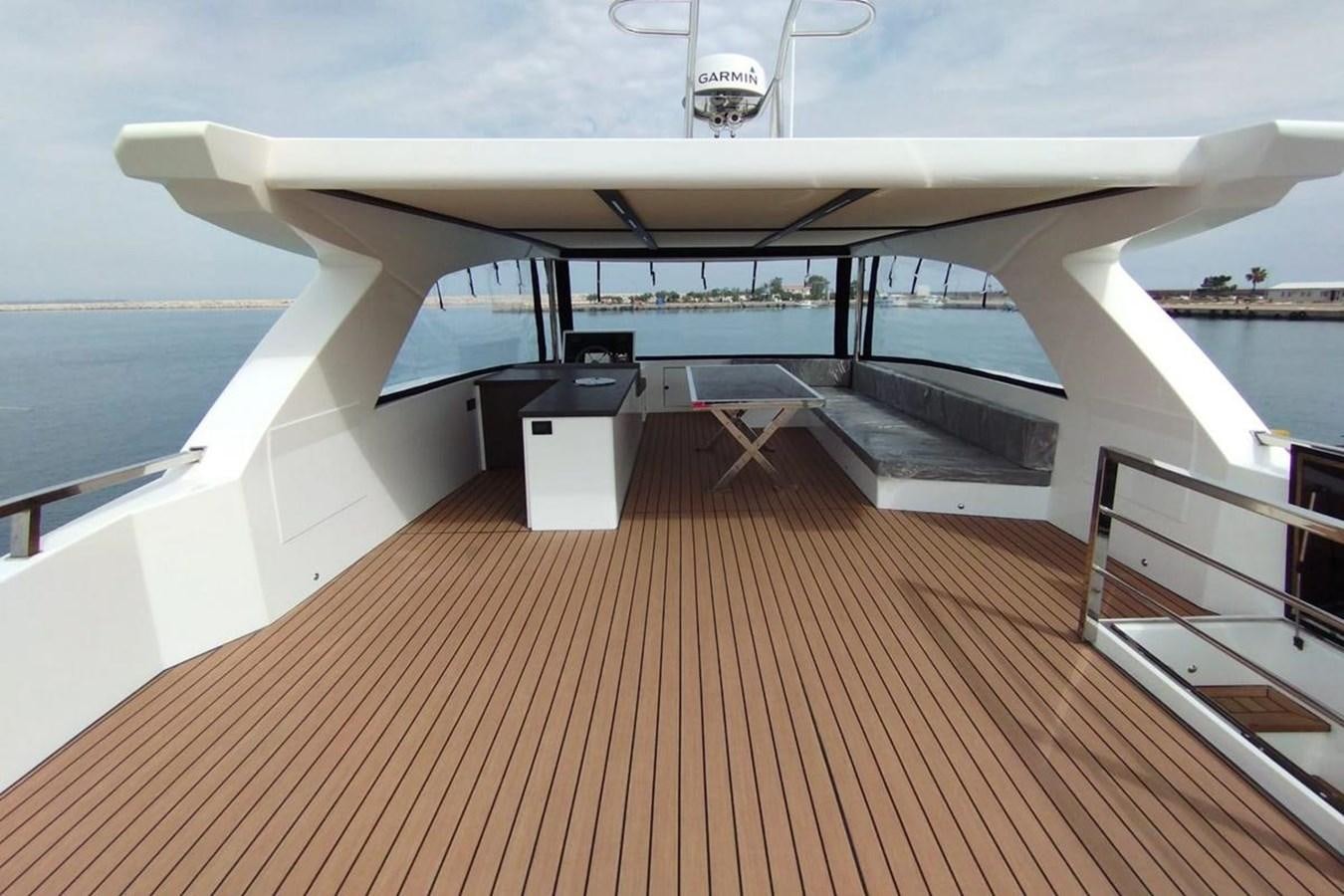 a boat on a deck aboard CARBOYACHT 68 Yacht for Sale