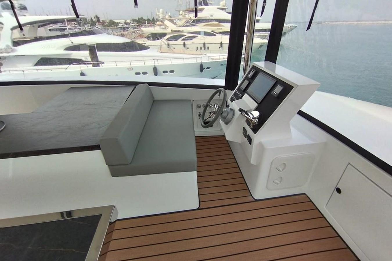 a white printer on a wooden surface aboard CARBOYACHT 68 Yacht for Sale