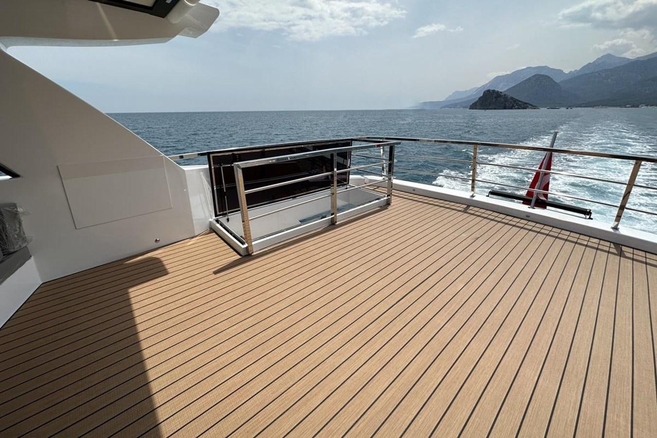 a deck overlooking a large body of water aboard CARBOYACHT 68 Yacht for Sale