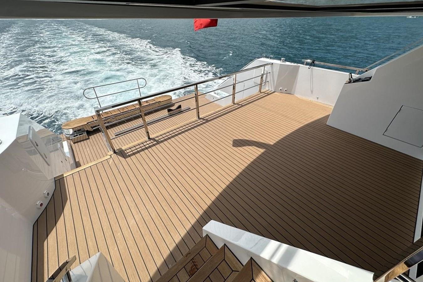 a deck with a railing and a body of water aboard CARBOYACHT 68 Yacht for Sale