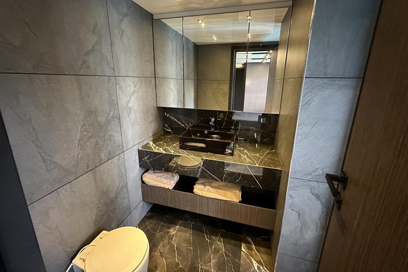 a bathroom with a sink and a toilet aboard CARBOYACHT 68 Yacht for Sale