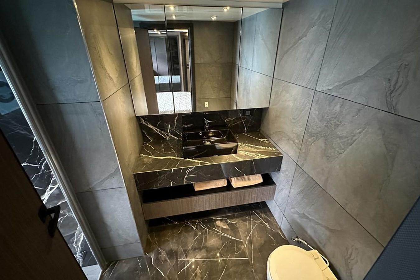 a bathroom with a marble counter aboard CARBOYACHT 68 Yacht for Sale