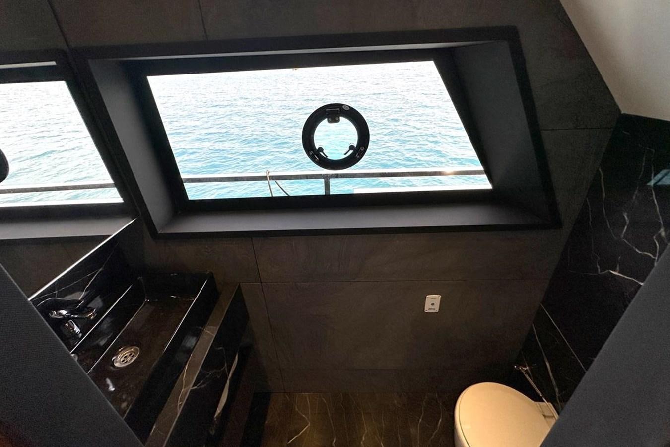 a window with a view of the ocean aboard CARBOYACHT 68 Yacht for Sale