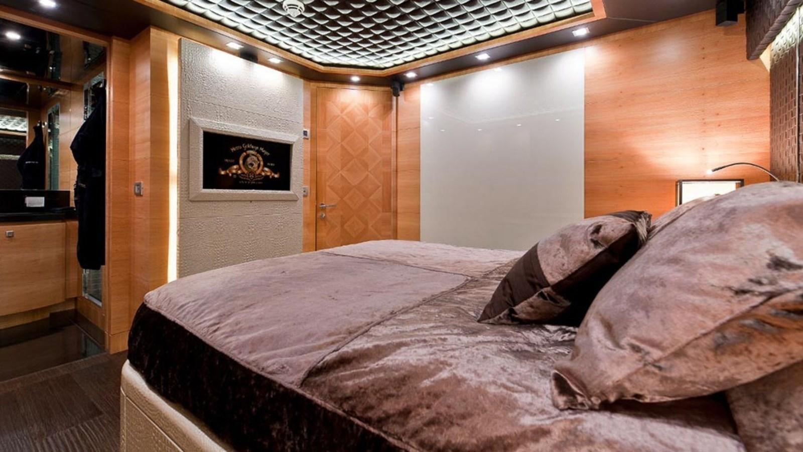 a bed with a white sheet aboard ELIZAVETA Yacht for Sale