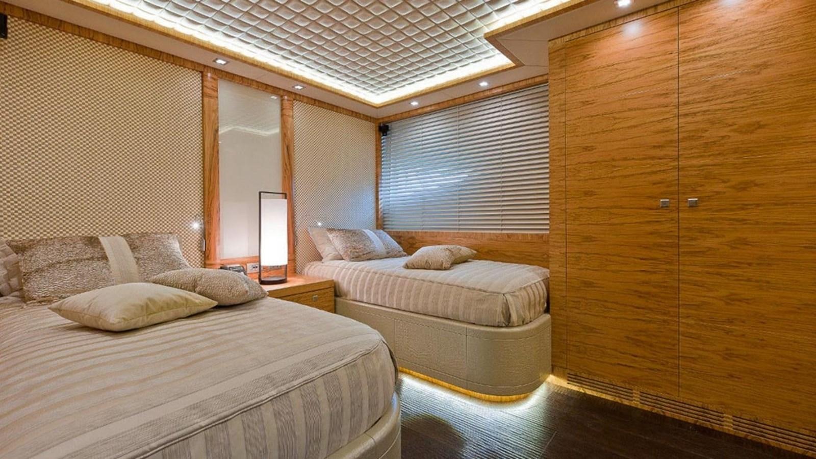 a room with two beds aboard ELIZAVETA Yacht for Sale
