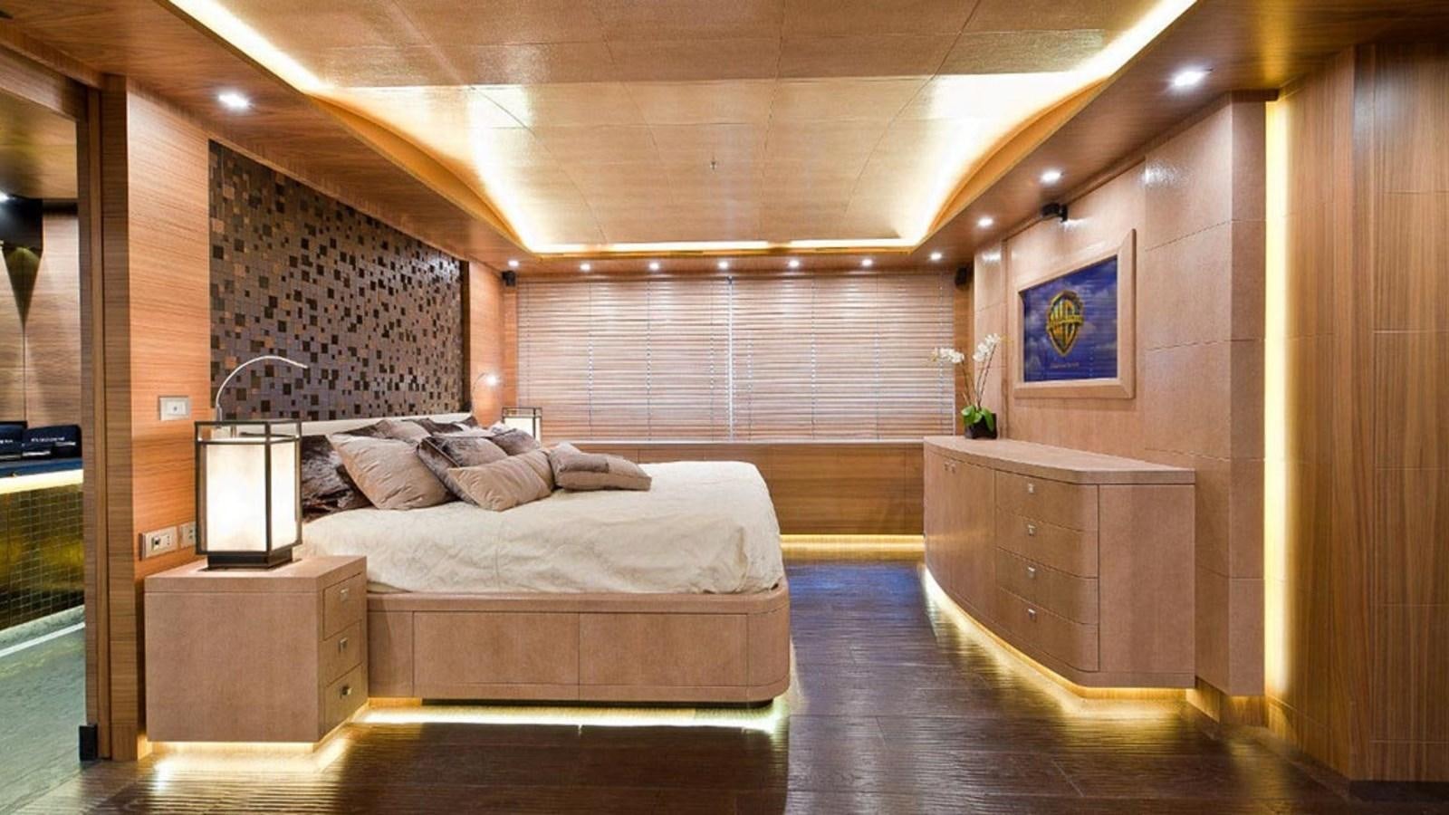 a room with a bed and a desk aboard ELIZAVETA Yacht for Sale