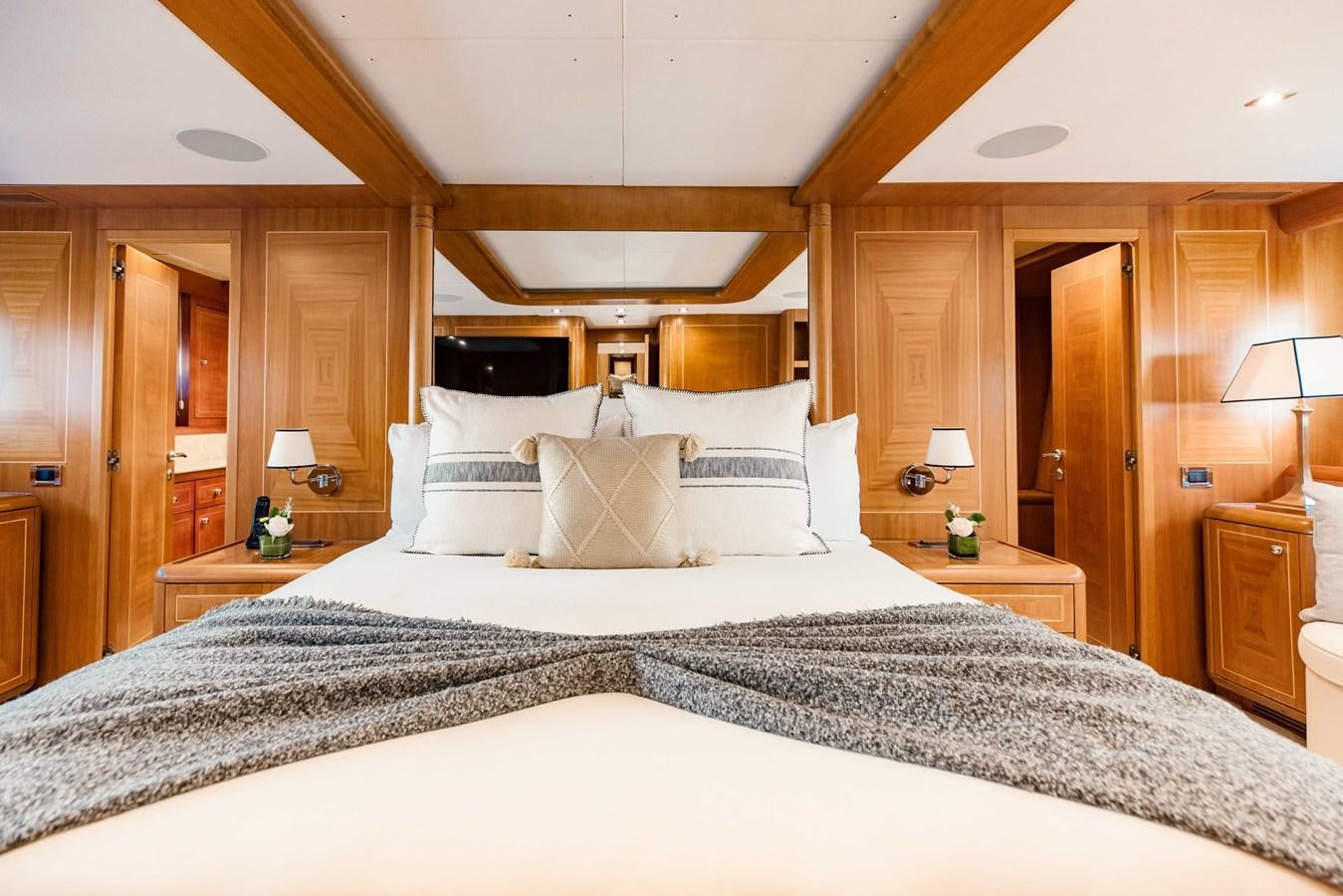 a large bed with white pillows aboard 7 KNOTS Yacht for Sale